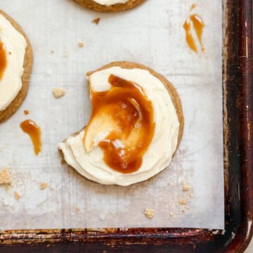a salted caramel cheesecake cookie with a bite missing.
