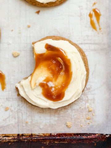 a salted caramel cheesecake cookie with a bite missing.