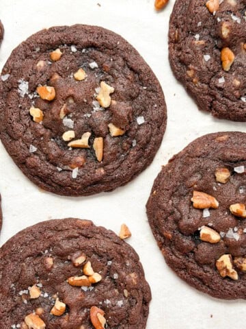 a close up of some chocolate turtle cookies.