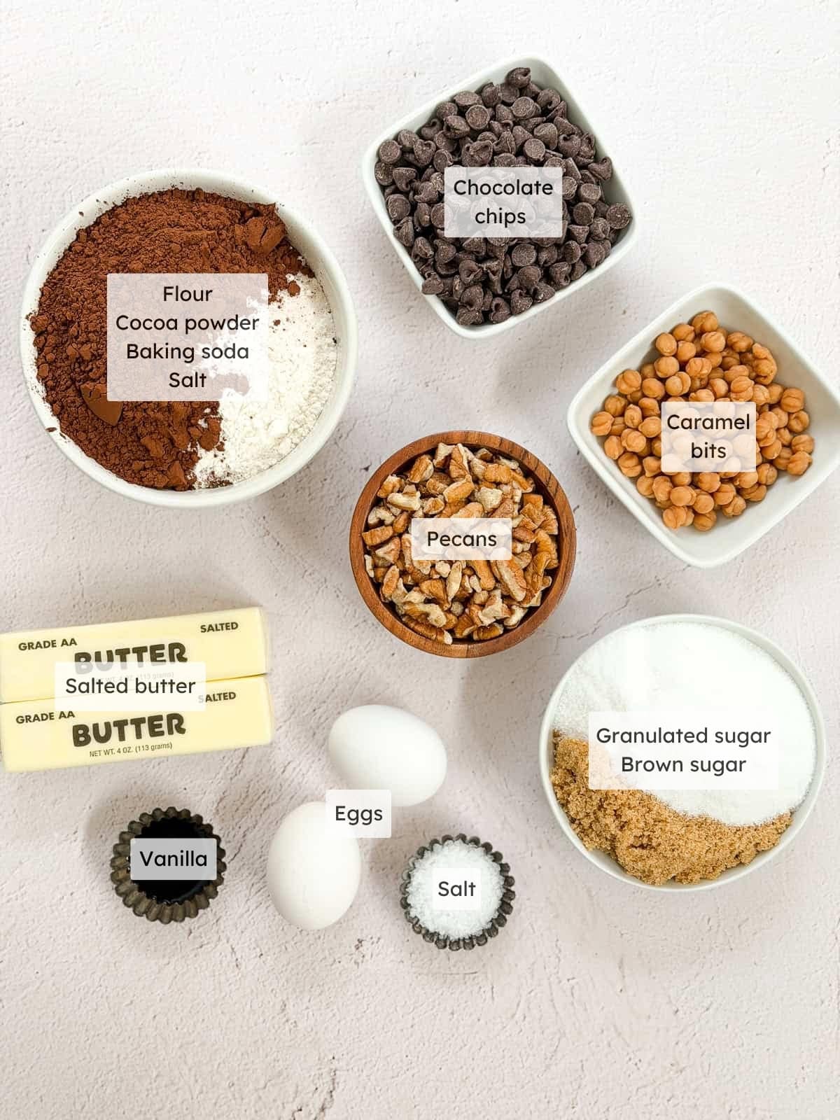 All of the ingredients needed to make chocolate turtle cookies.