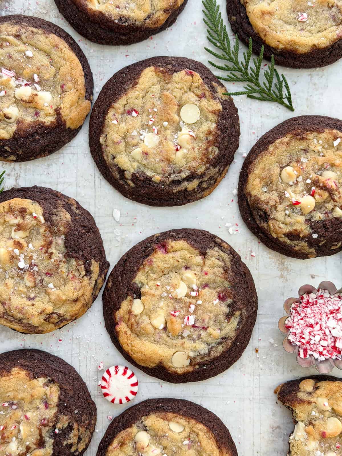 Peppermint white chocolate brookies cookies all together with peppermint candies on the side.