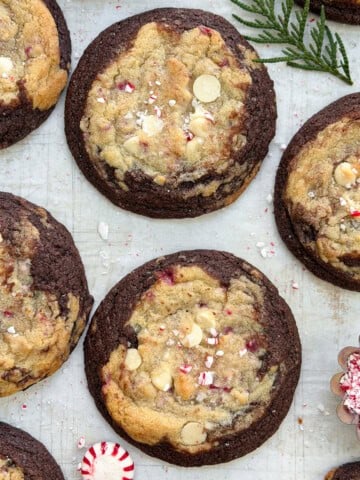 Peppermint white chocolate brookies cookies all together with peppermint candies on the side.