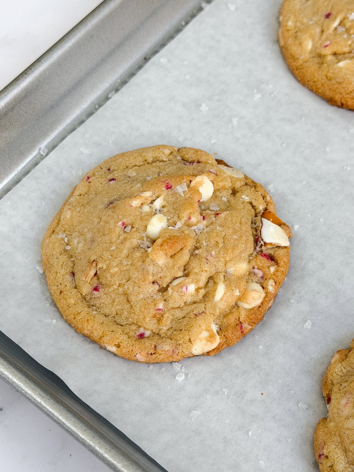 a side view of a white chocolate peppermint pretzel cookies.