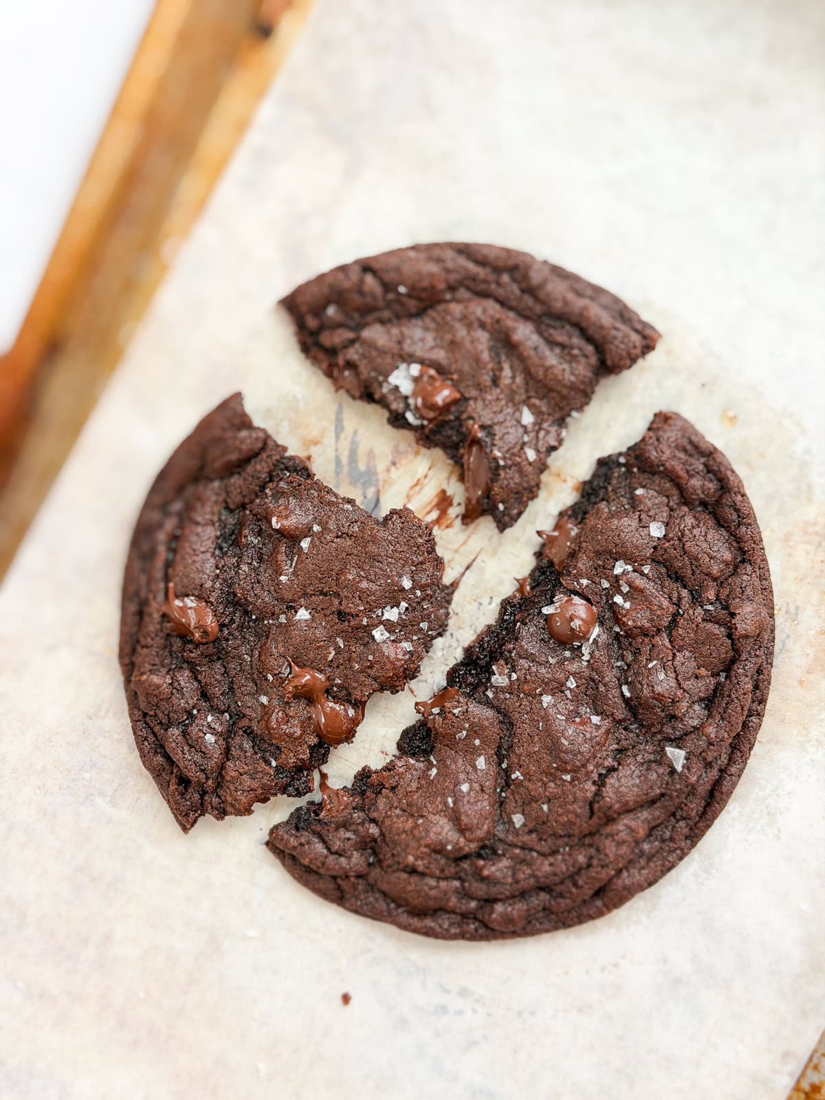 single serve double chocolate cookie broken into pieces.