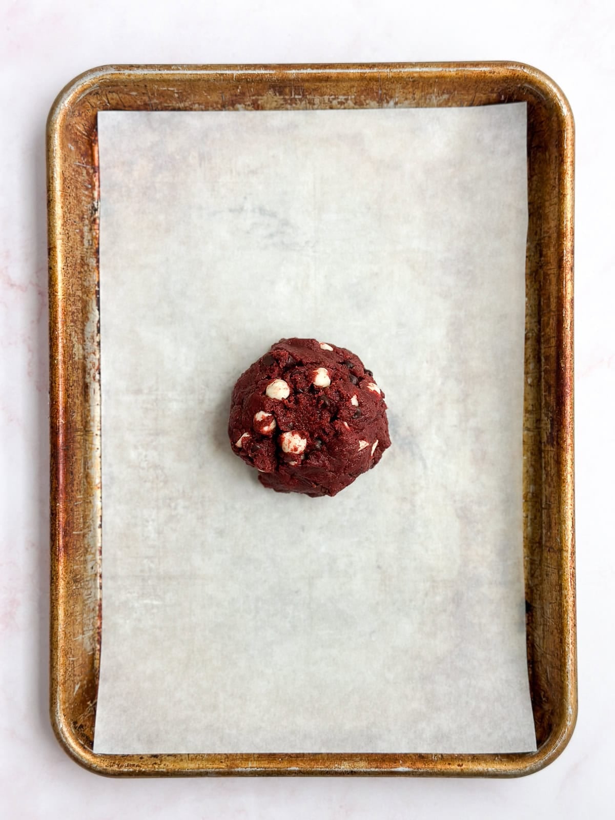 one cookie dough ball before baking.