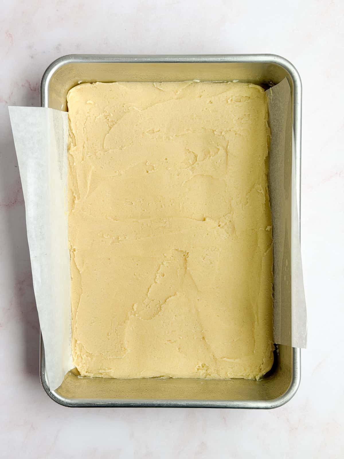 cookie dough smoothed into the baking pan.