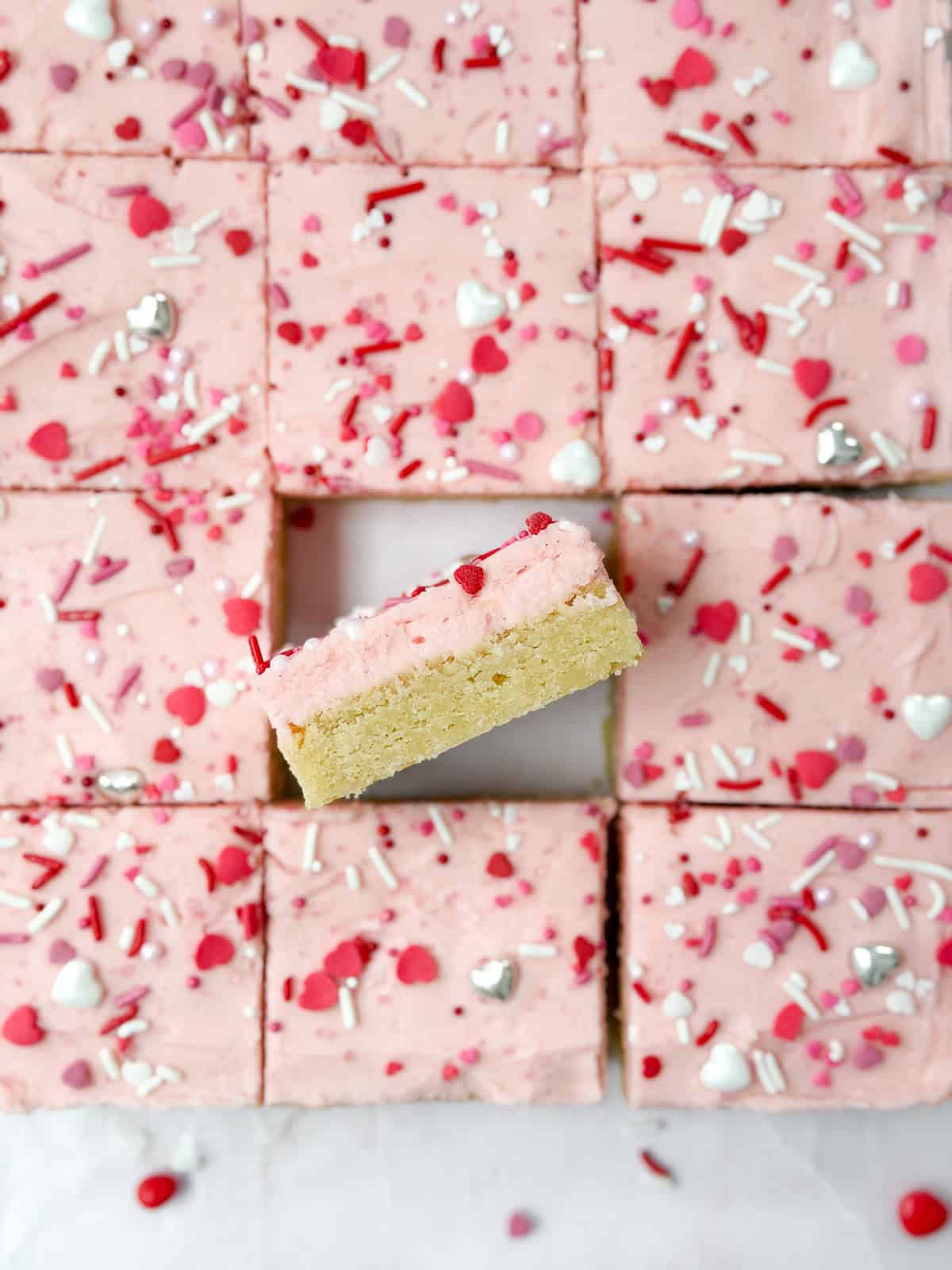 the chewy sugar cookie bars cut and one turned inside so you can see the layers.