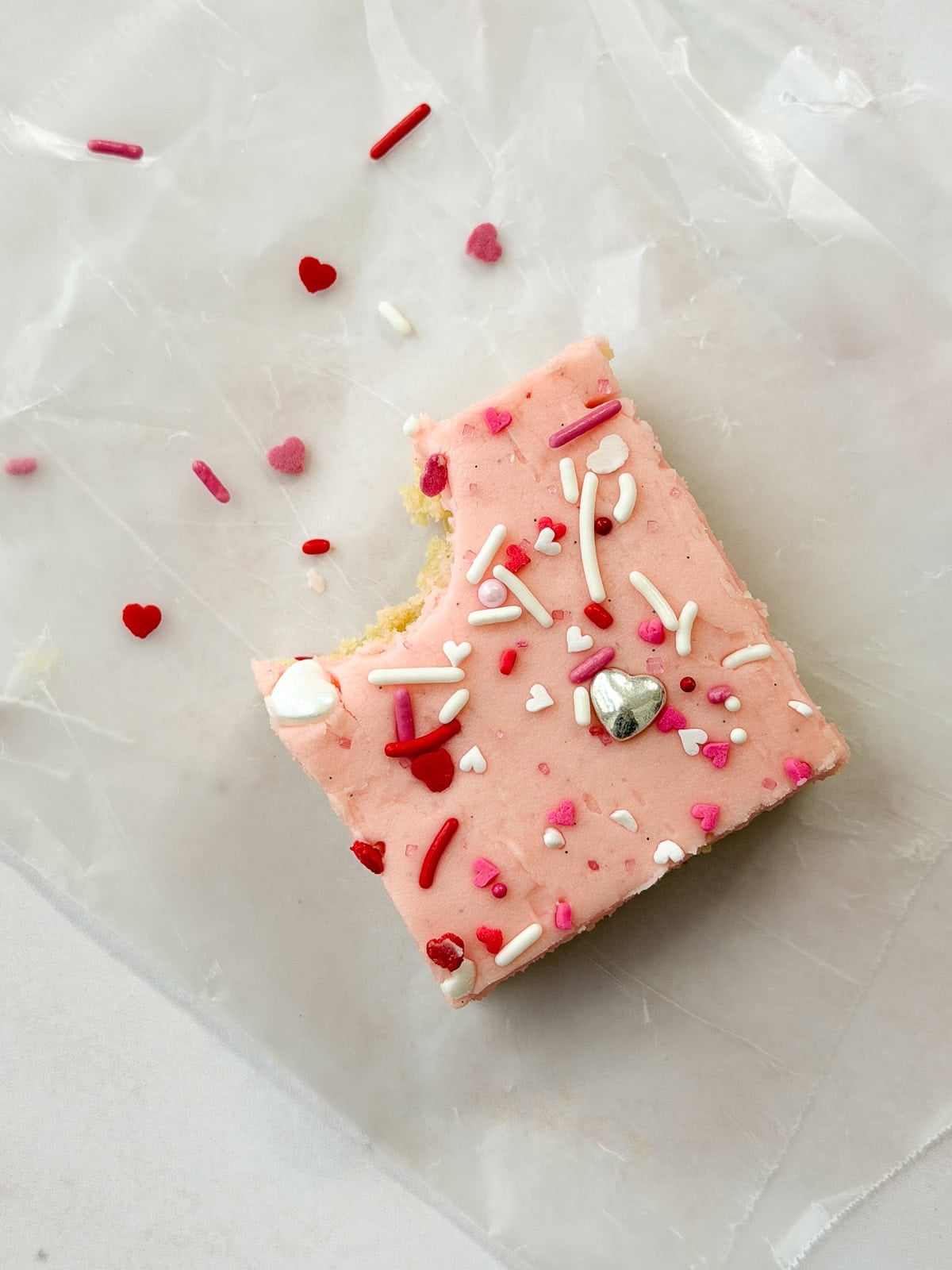 a single cookie bar with a bite missing.