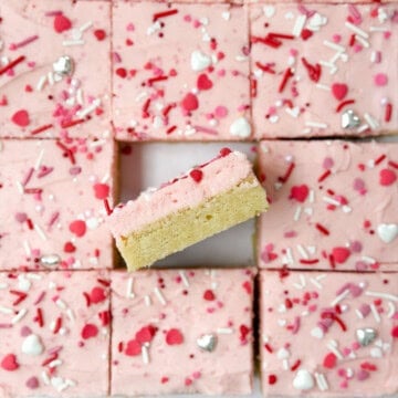 the chewy sugar cookie bars cut and one turned inside so you can see the layers.