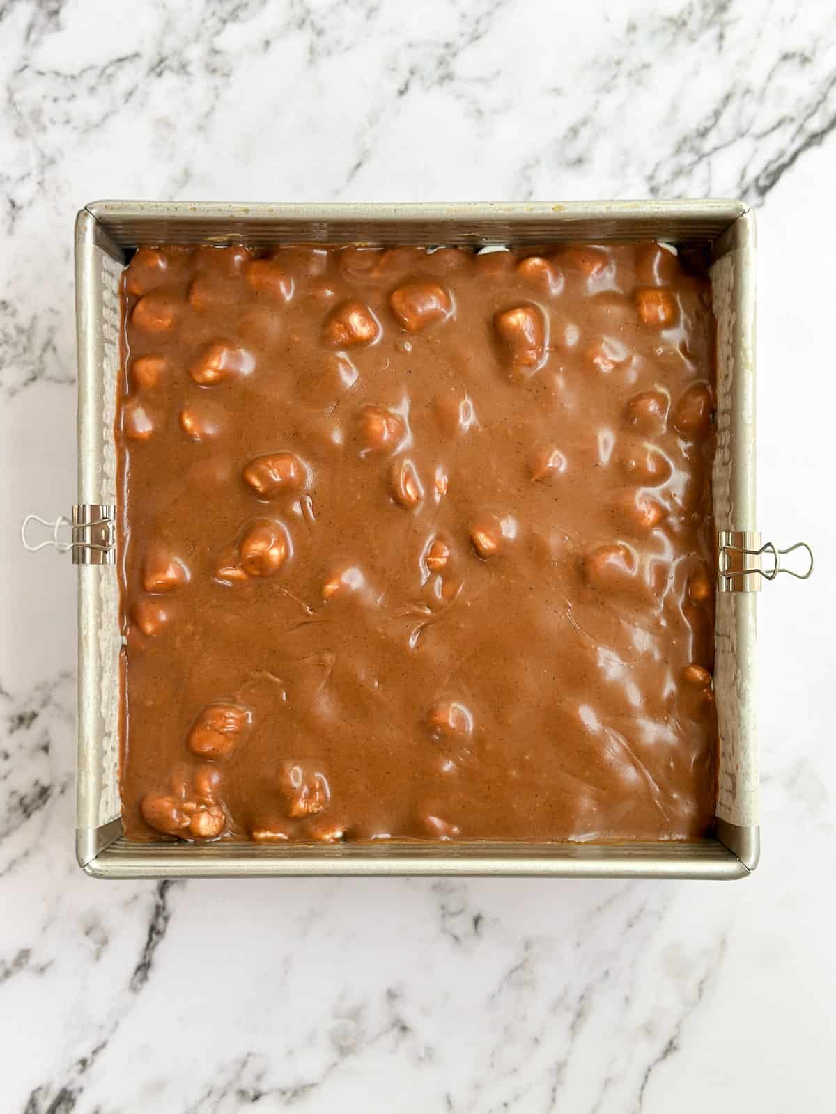brownies topped with chocolate frosting.