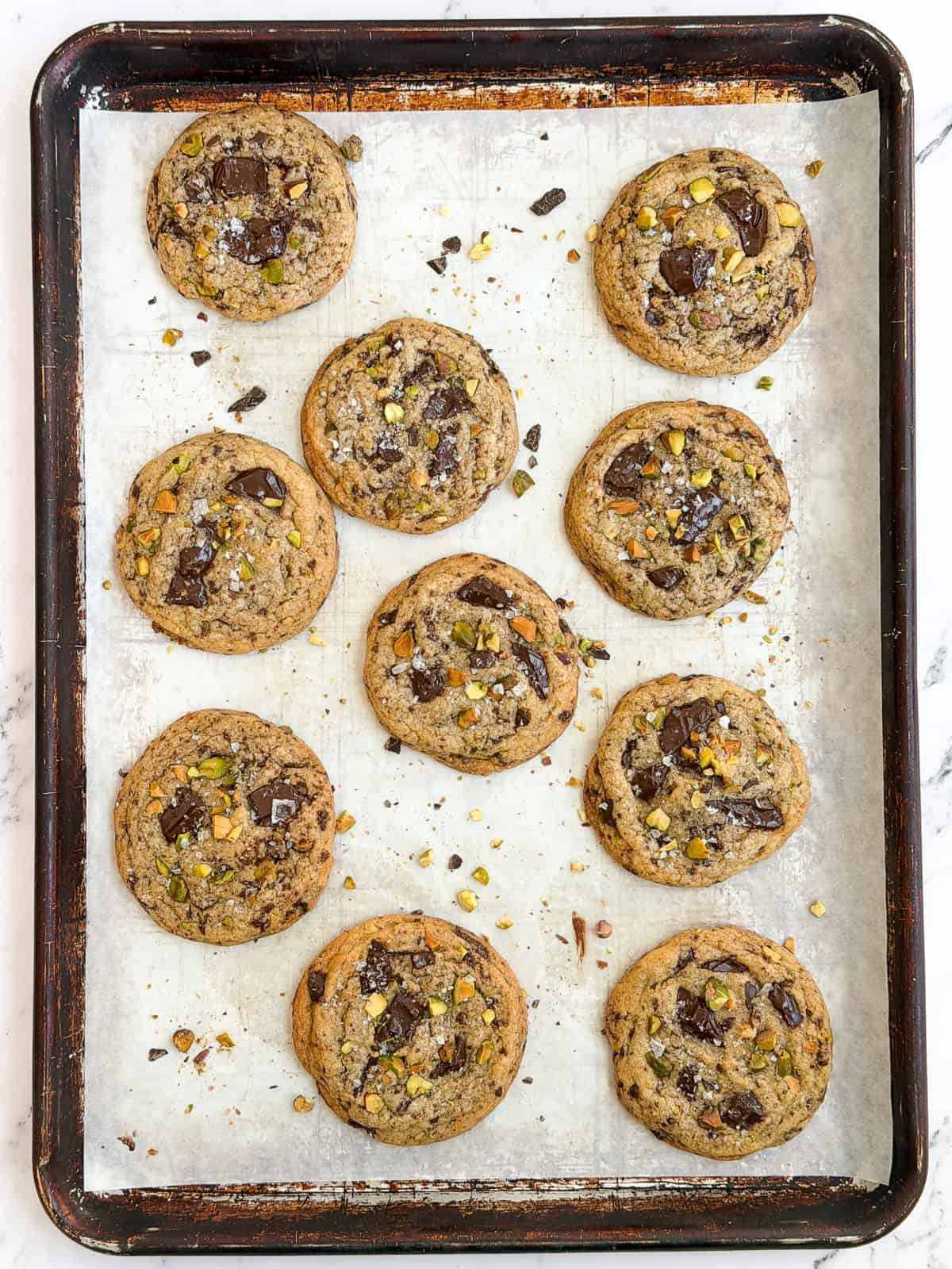 all the pistachio chocolate chip cookies on a baking sheet.