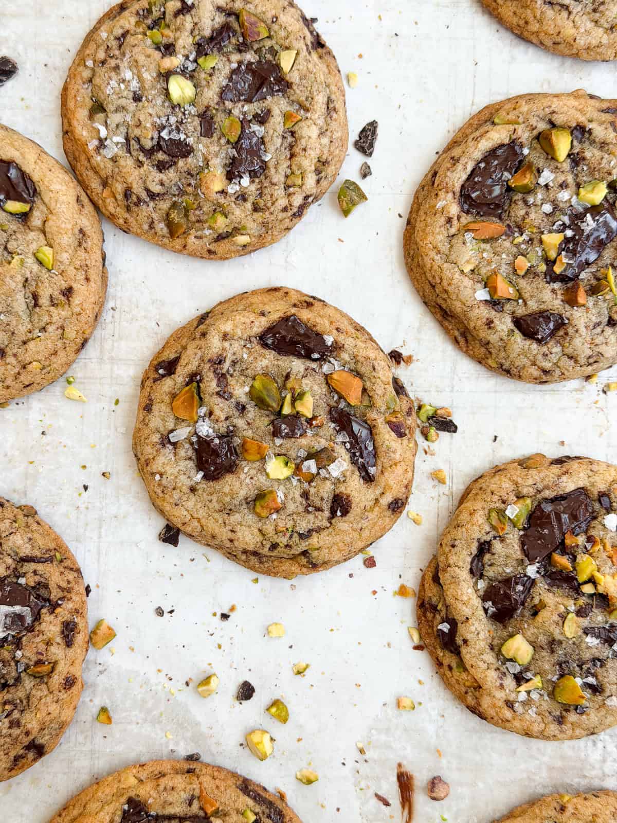 some of the pistachio chocolate chip cookies on a baking sheet.