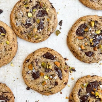 some of the pistachio chocolate chip cookies on a baking sheet.