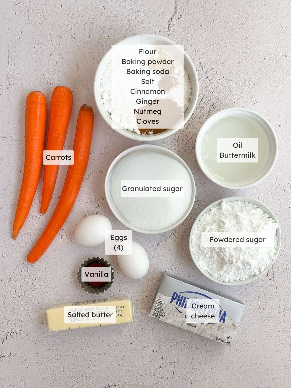All of the ingredients needed to make the carrot cake with brown butter cream cheese frosting.