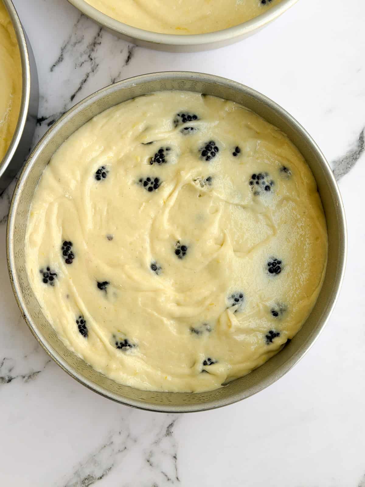 batter added to cake pans.