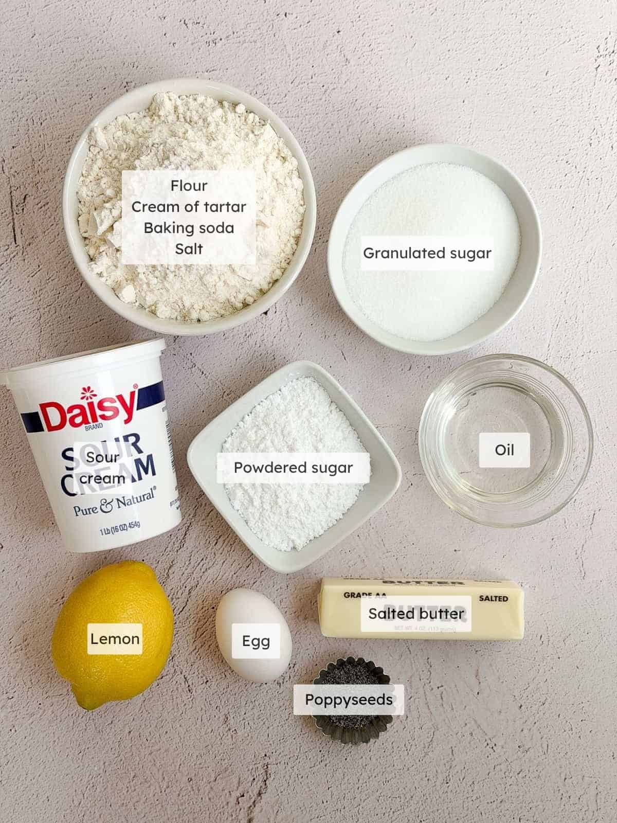 All of the ingredients needed to make lemon poppyseed cookies.