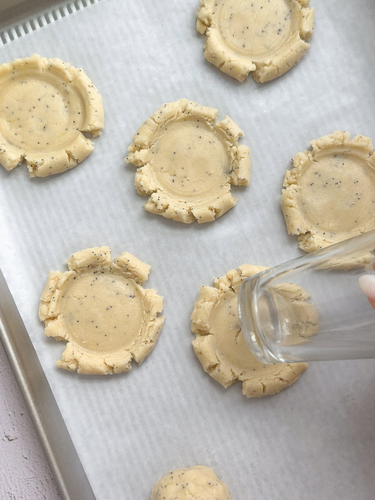 cookies flattened with a cup before baking.