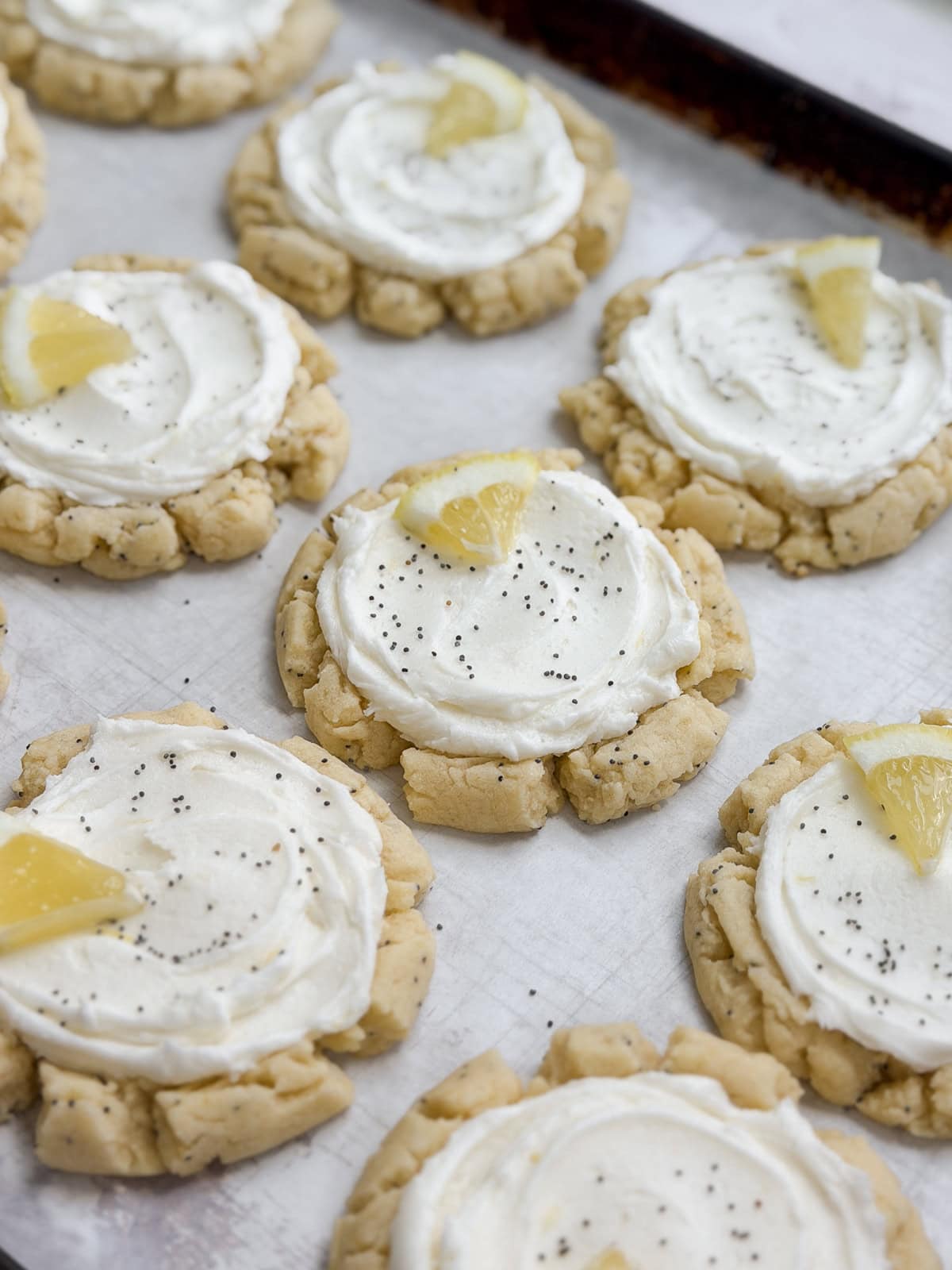 a side view of a full sheet of lemon poppyseed cookies.