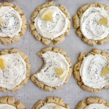 lemon poppyseed cookies with a bite missing from one.