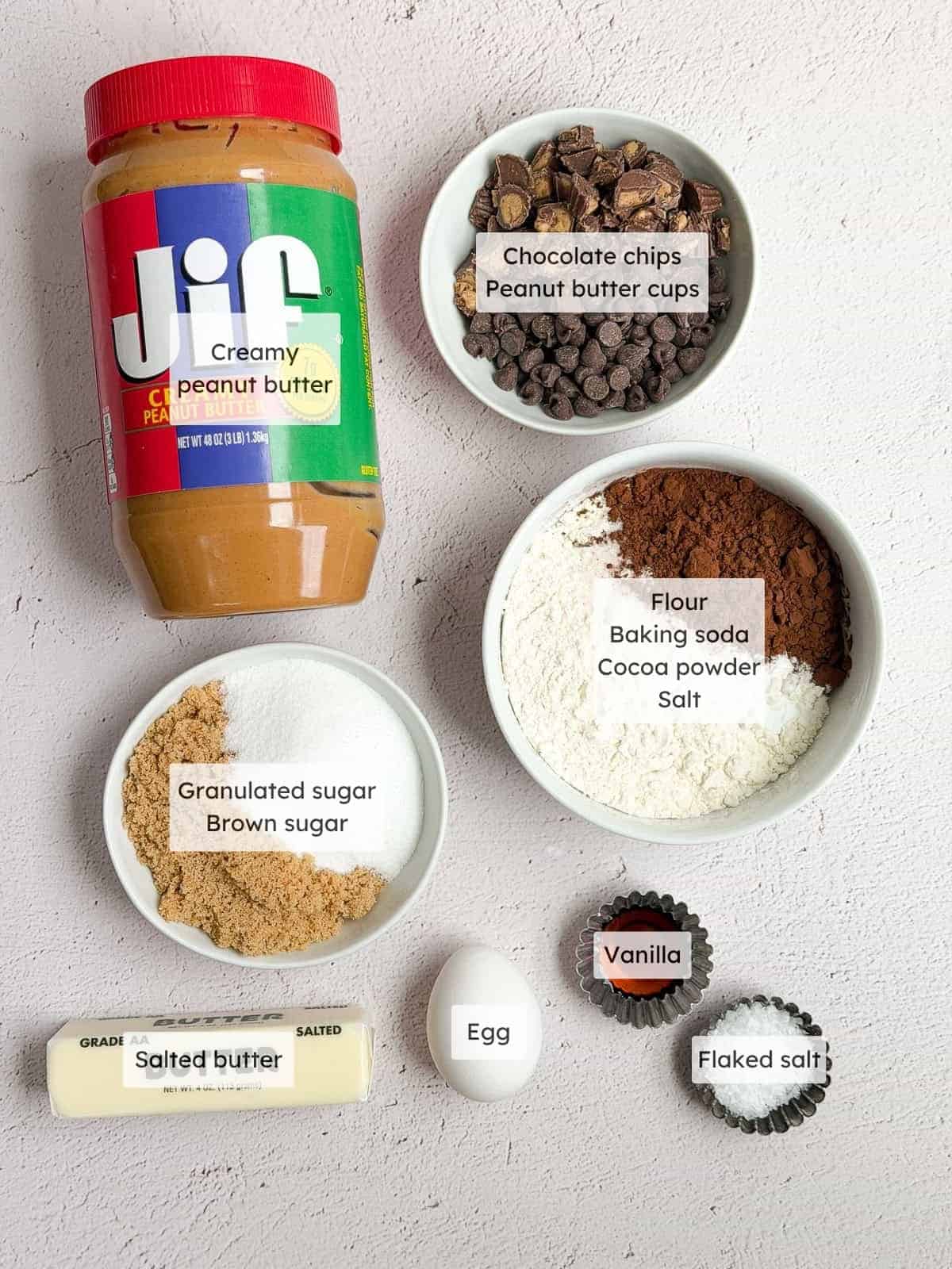 All the ingredients needed to make chocolate peanut butter cup cookies.