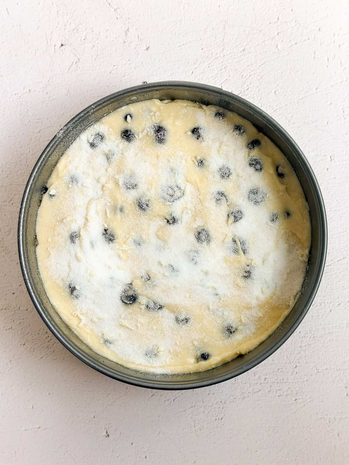 the cake in the pan before baking.