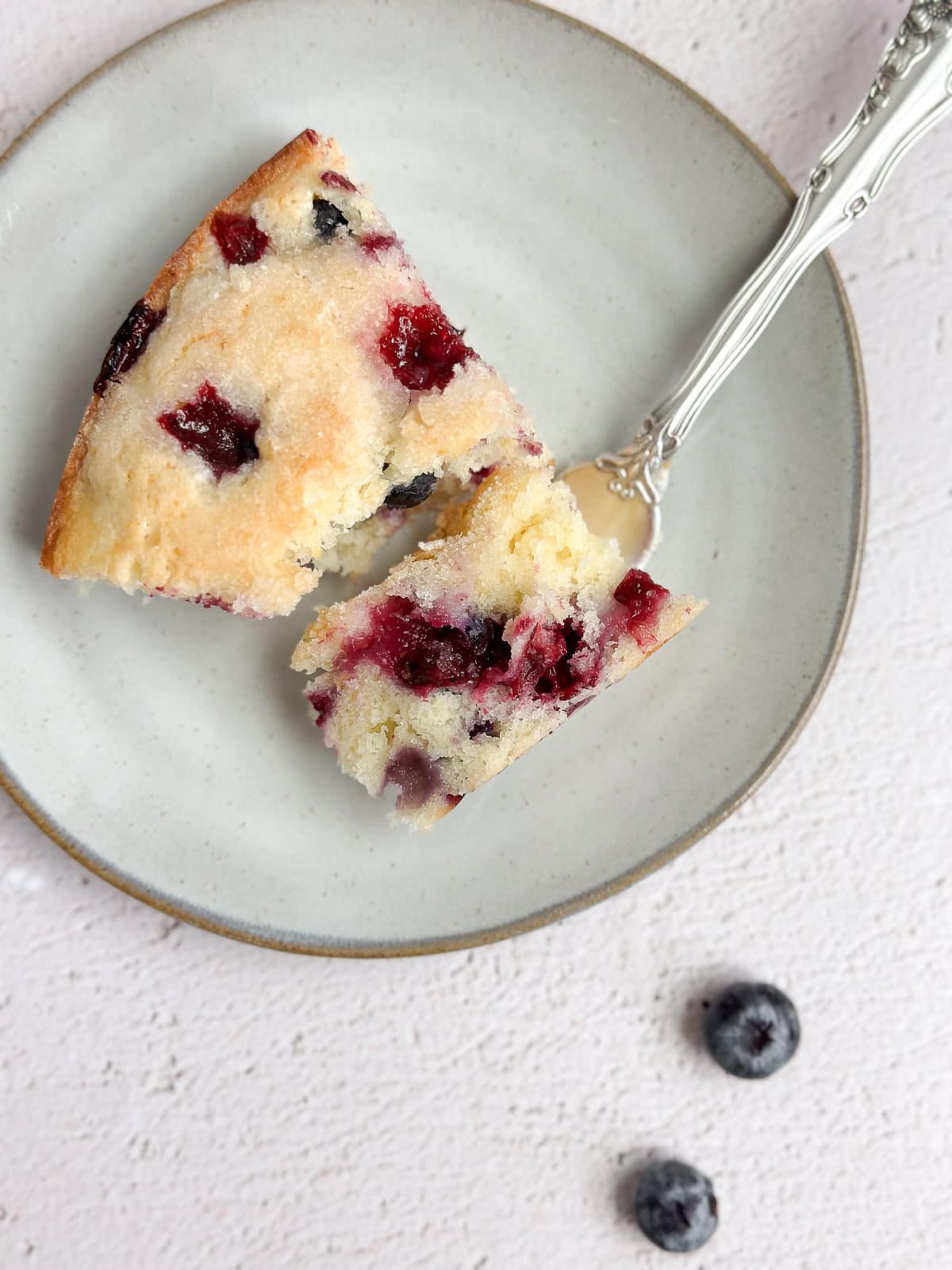 an aerial view of a slice of cake with a bite showing the inside and texture.