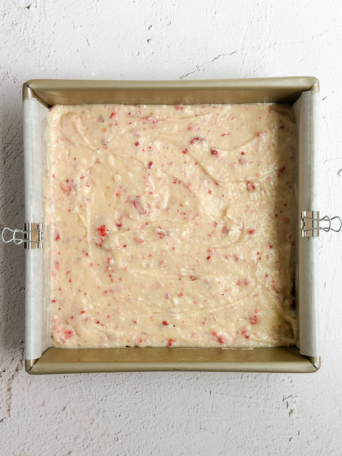cake batter in the pan before baking.