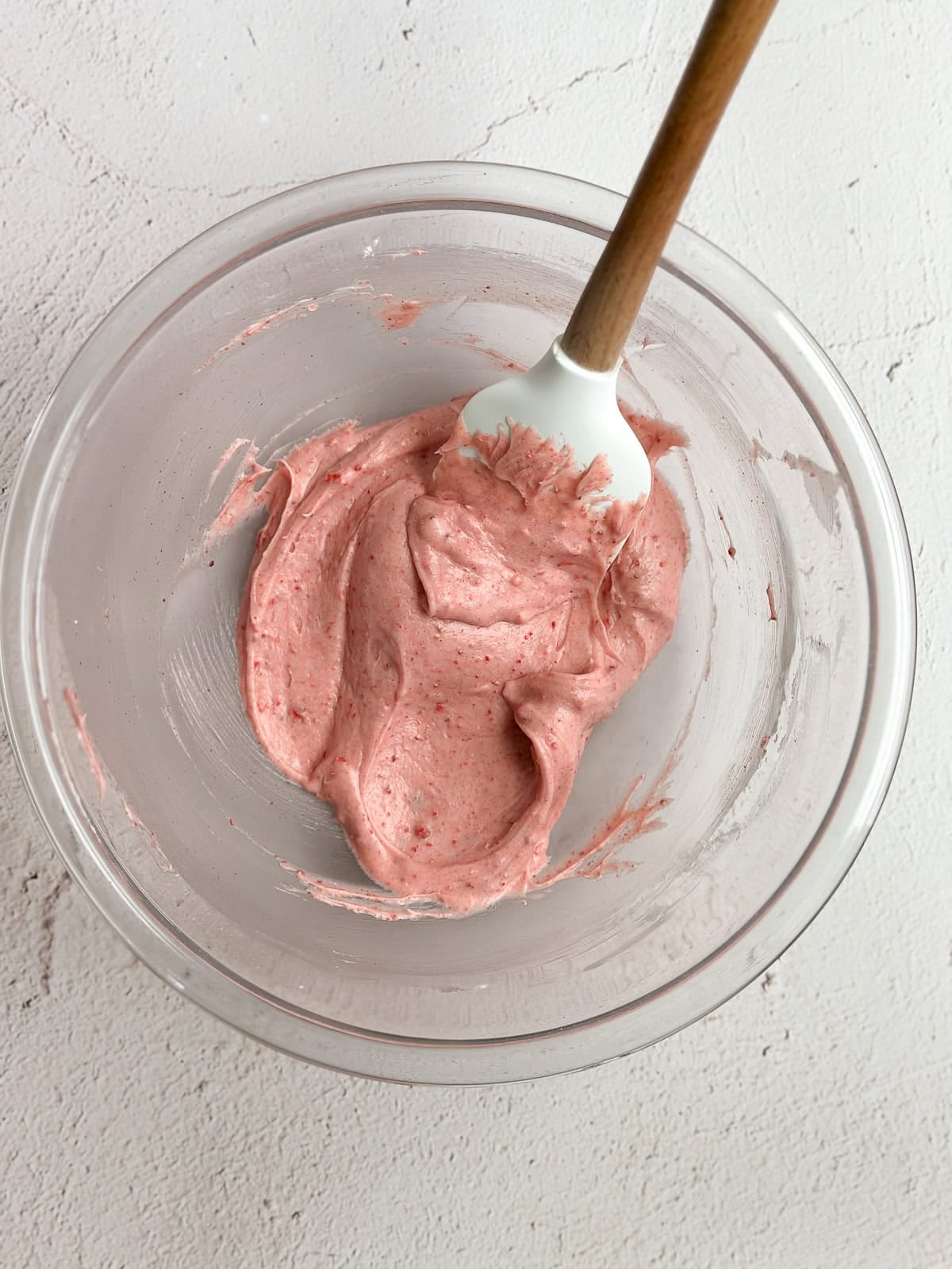 strawberry cream cheese frosting in a bowl.