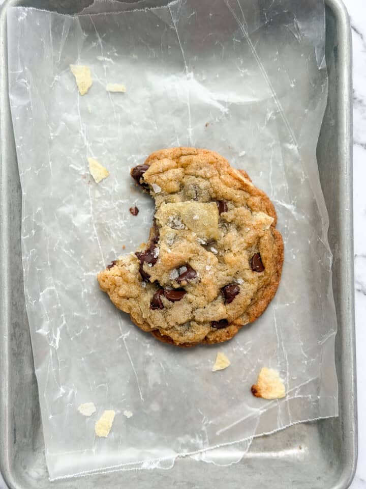 a close up of a single cookie with a bite missing.