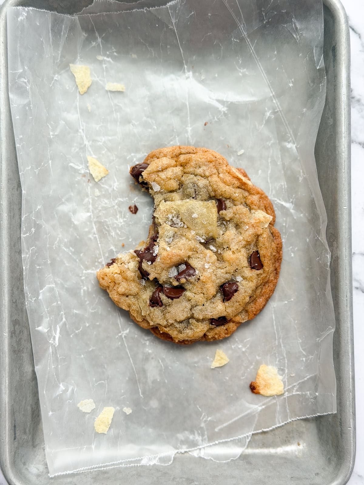 a close up of a single cookie with a bite missing.