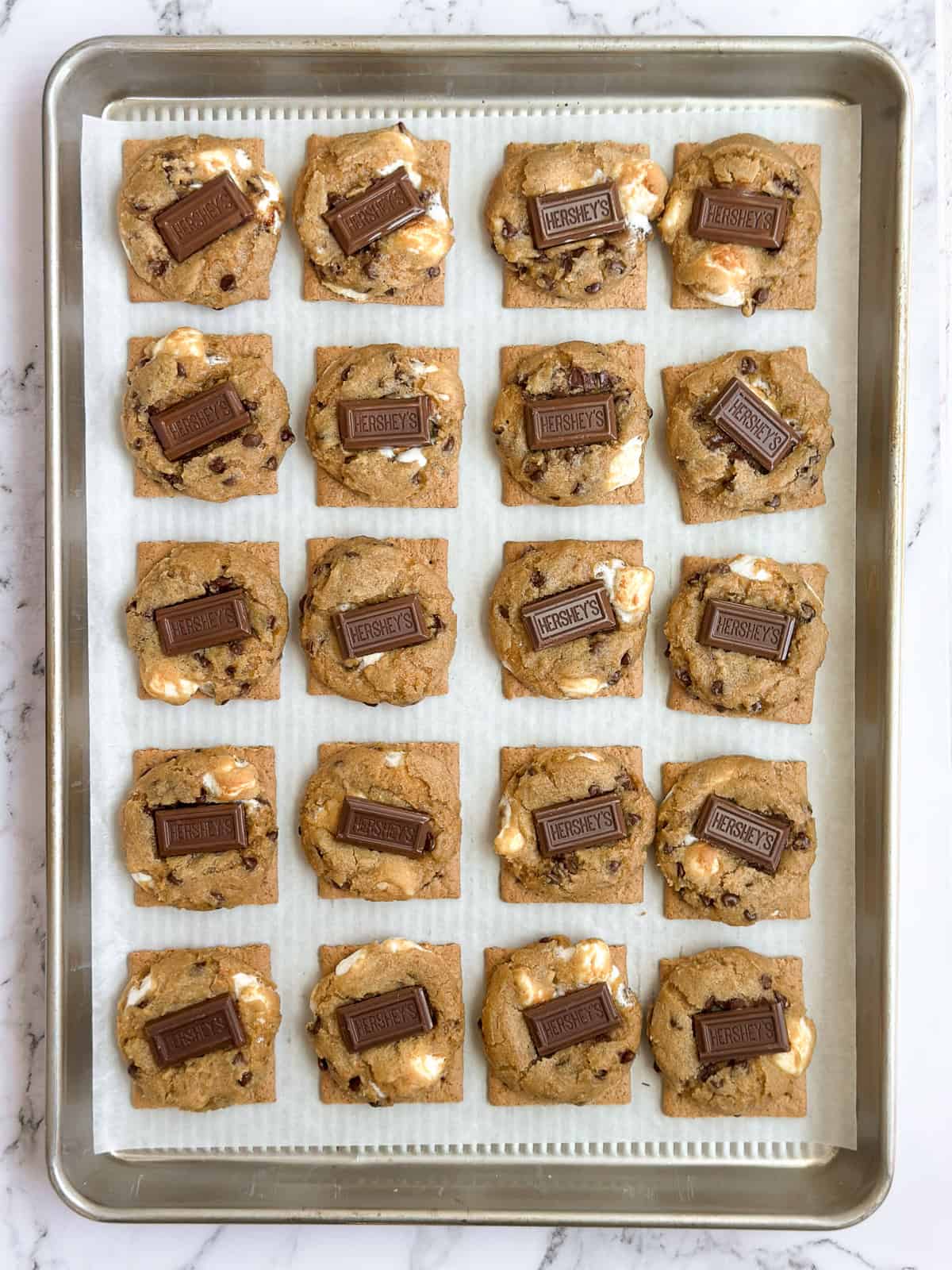 cookies topped with chocolate after baking.