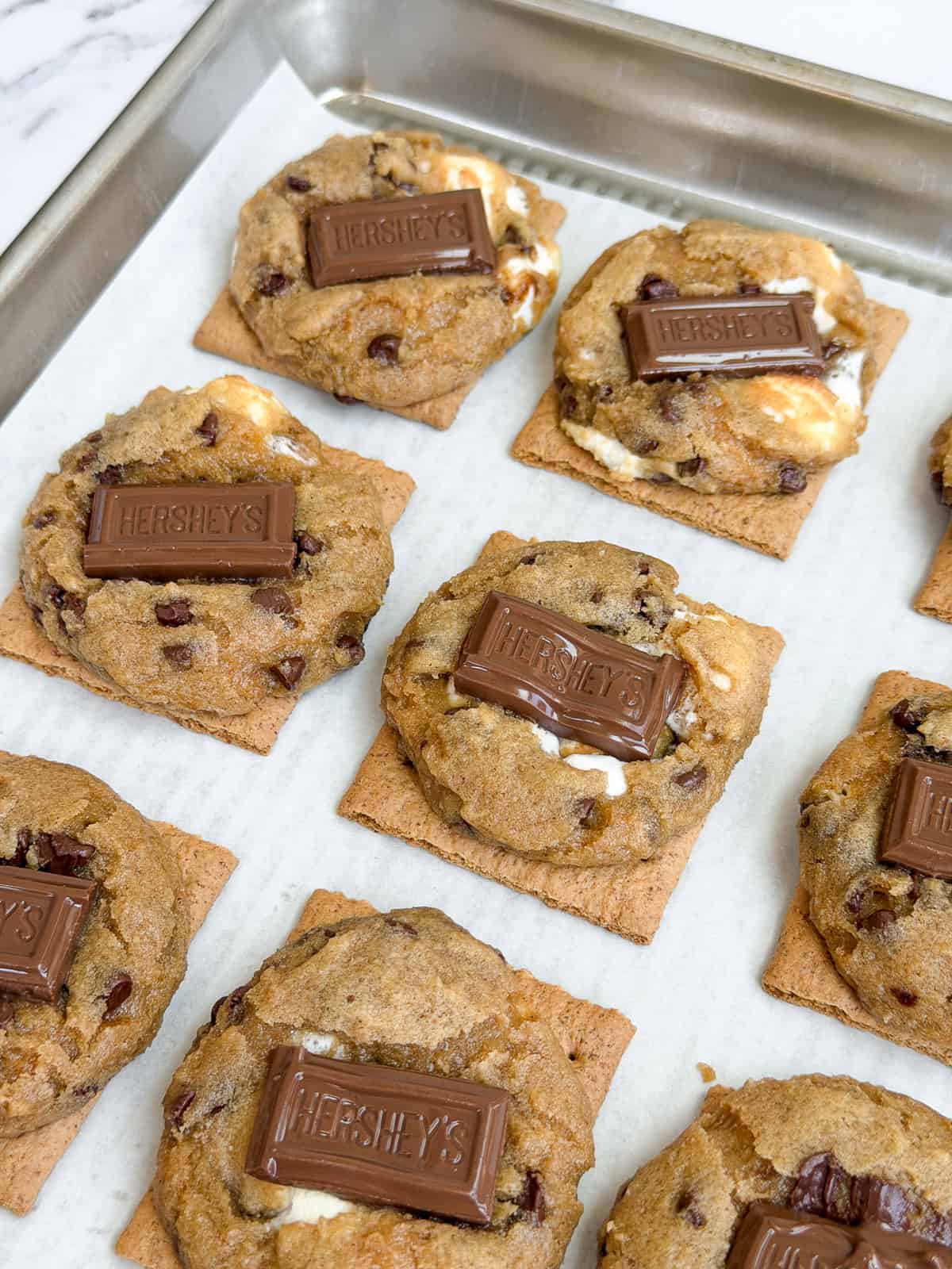 a side view of the s'more cookies with the chocolate all melty.