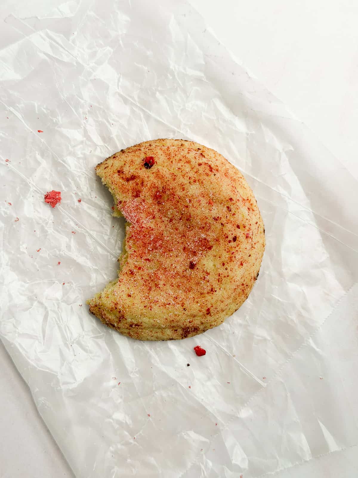one strawberry doodle with a bite missing.