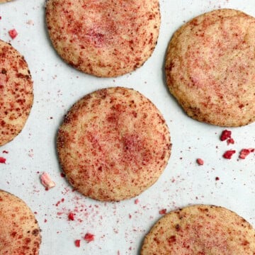 strawberry doodle cookies on a cookie sheet.