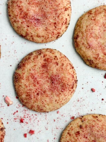 strawberry doodle cookies on a cookie sheet.