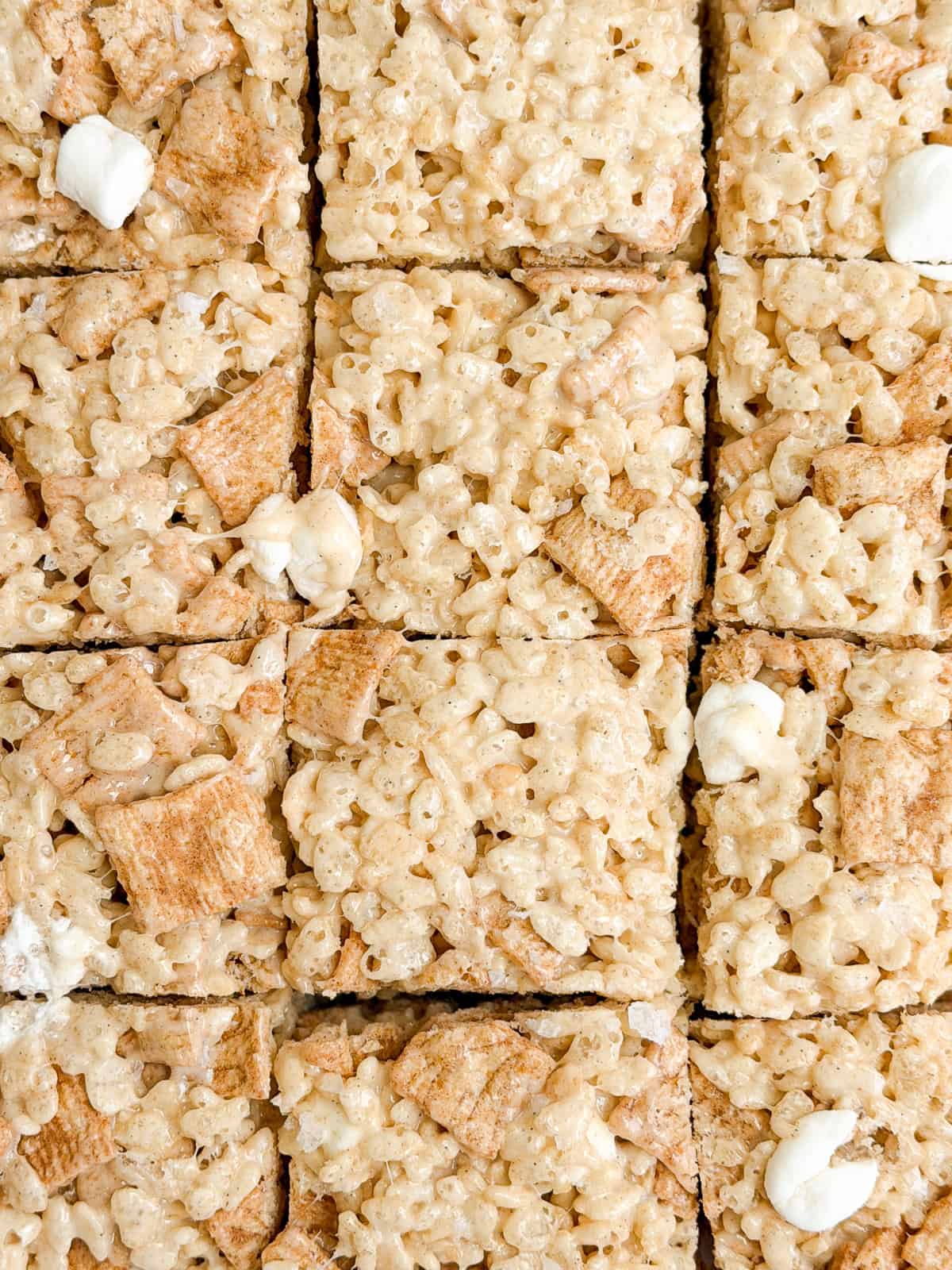 the whole batch cinnamon toast crunch marshmallow treats cut into squares.