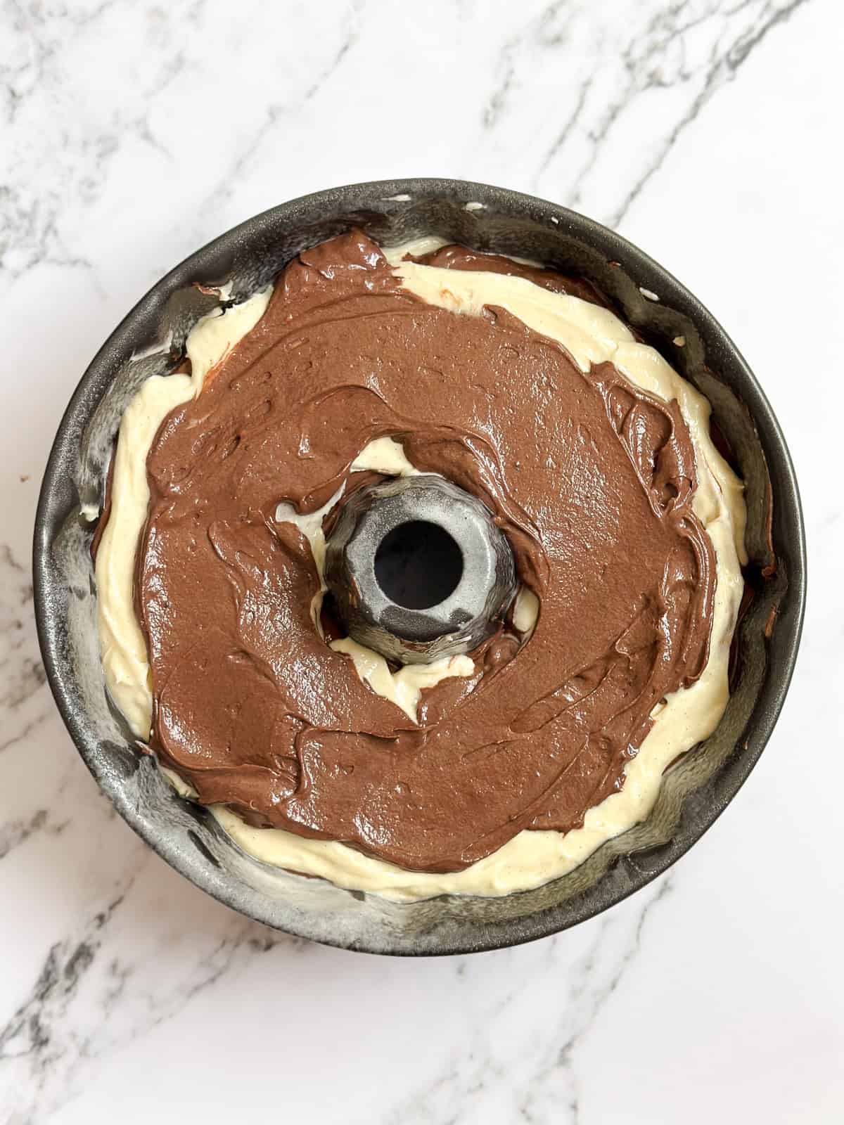 layers added to the bundt cake pan.