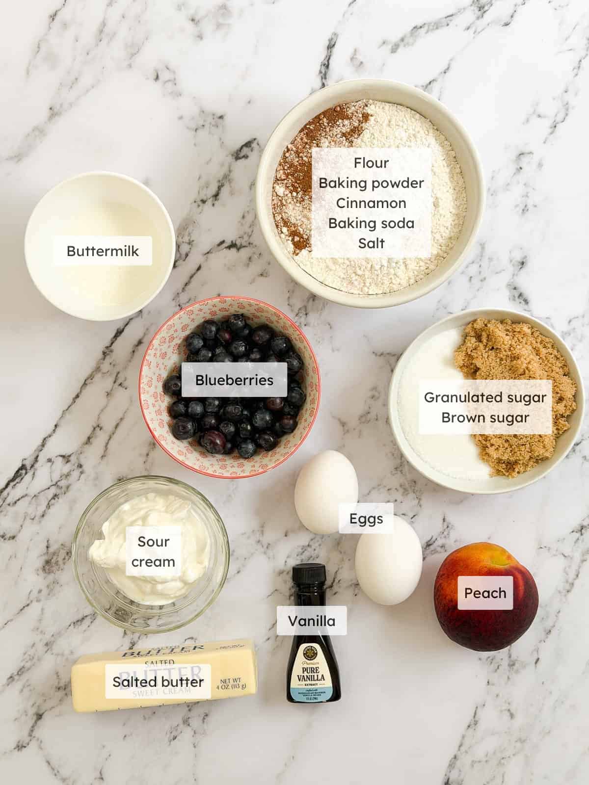 All of the ingredients to make blueberry peach muffins.