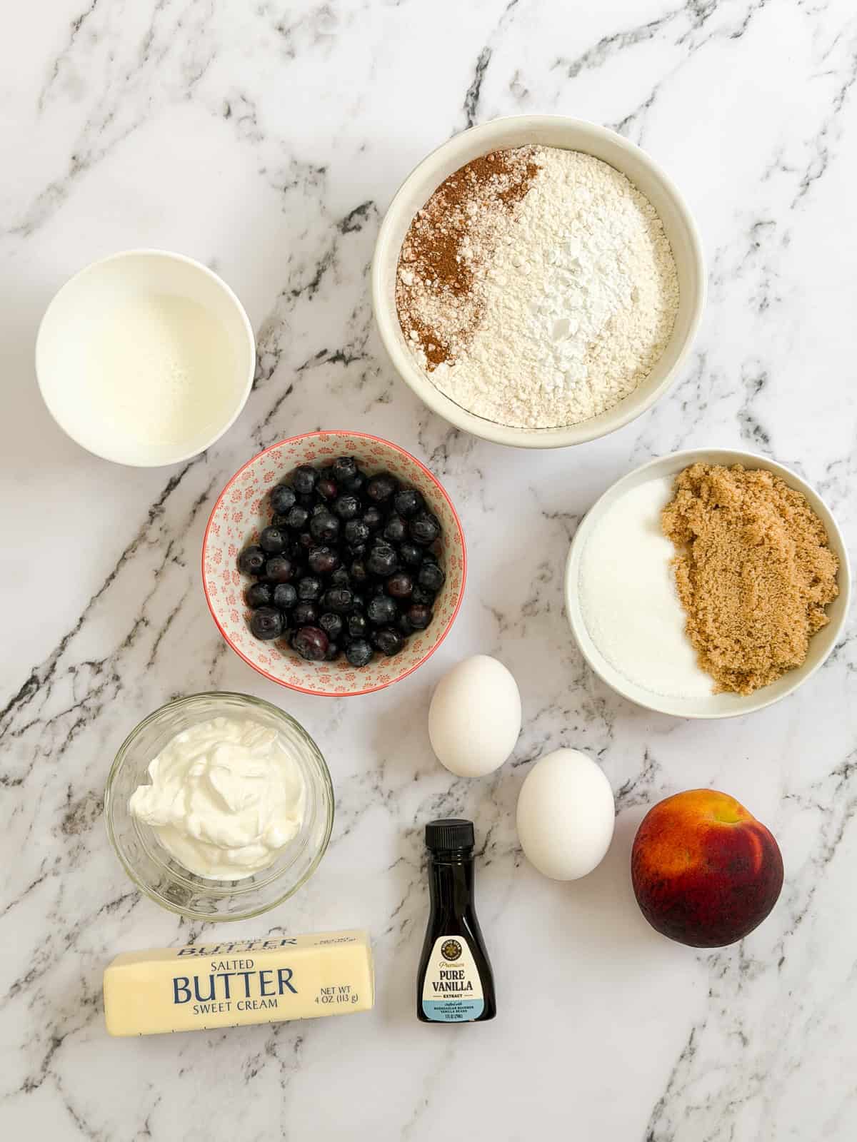 all the ingredients needed to make these blueberry peach muffins.