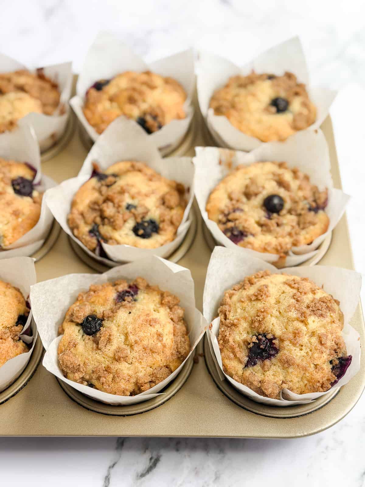 a side view of the muffins in the muffin tin.