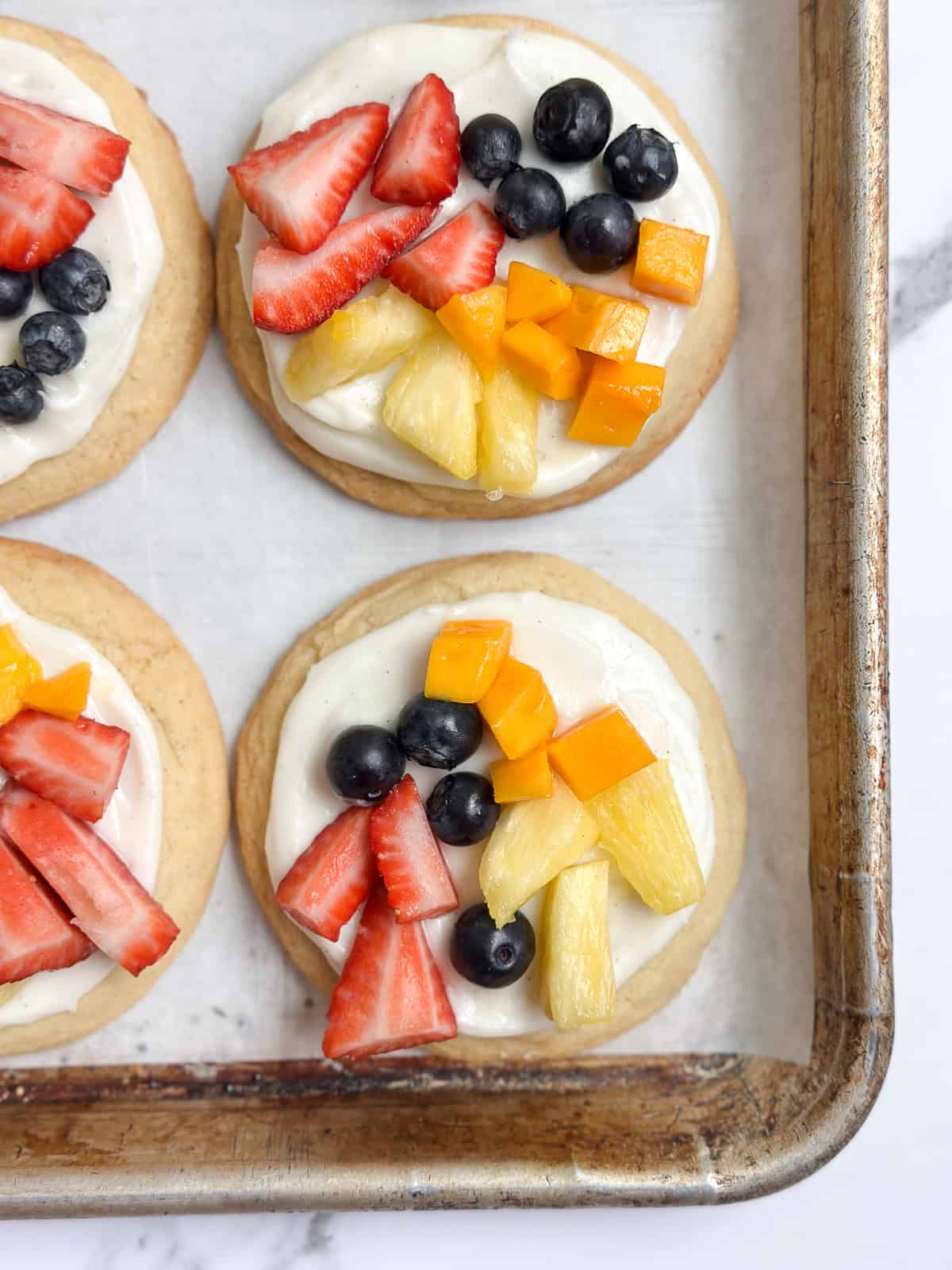 cookies topped with fresh fruit.