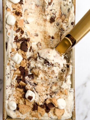 an ice cream scoop scooping out some homemade s'mores ice cream.