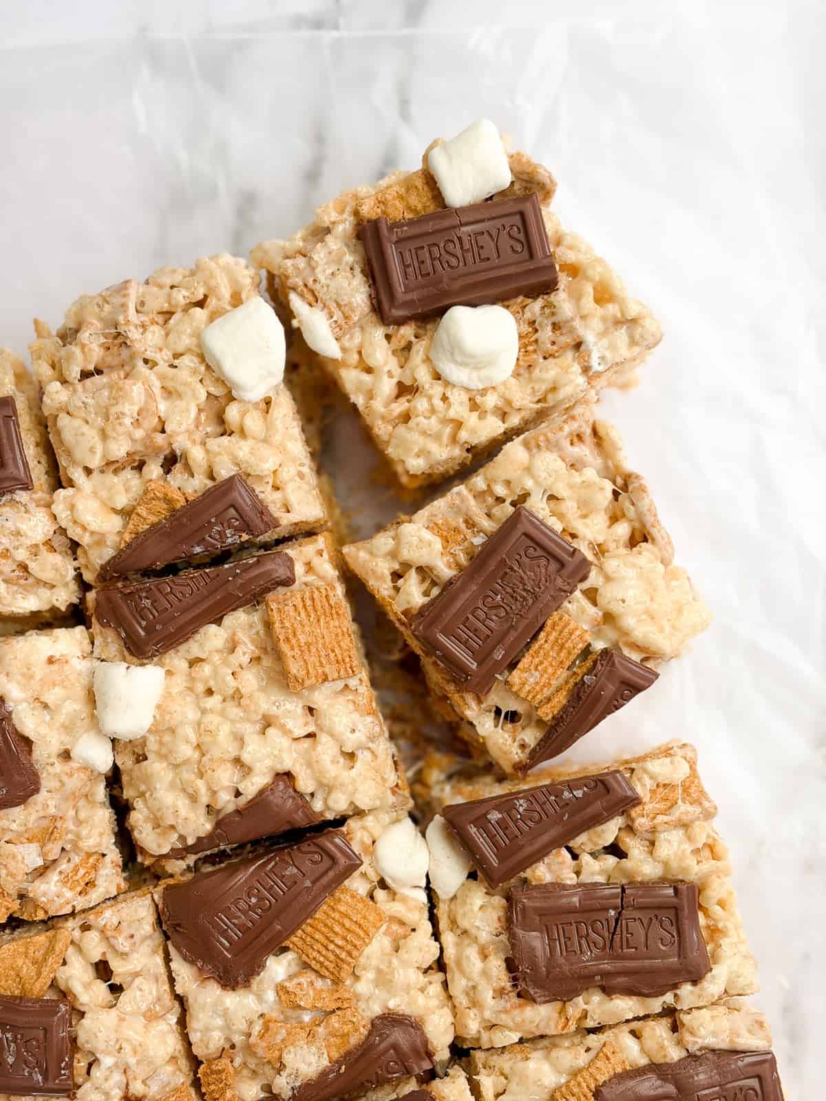 a few s'mores golden graham rice krispie treats cut into squares.
