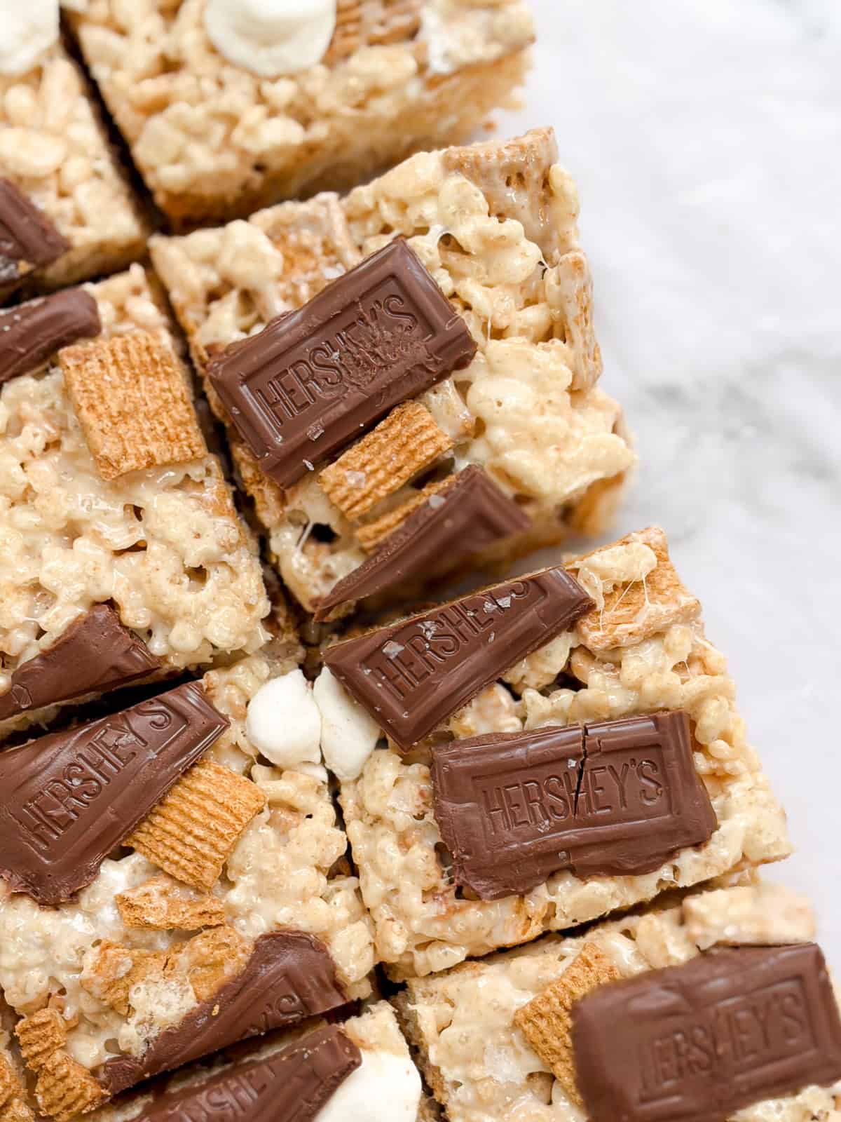 a close up of a few s'mores golden graham rice krispie treats.