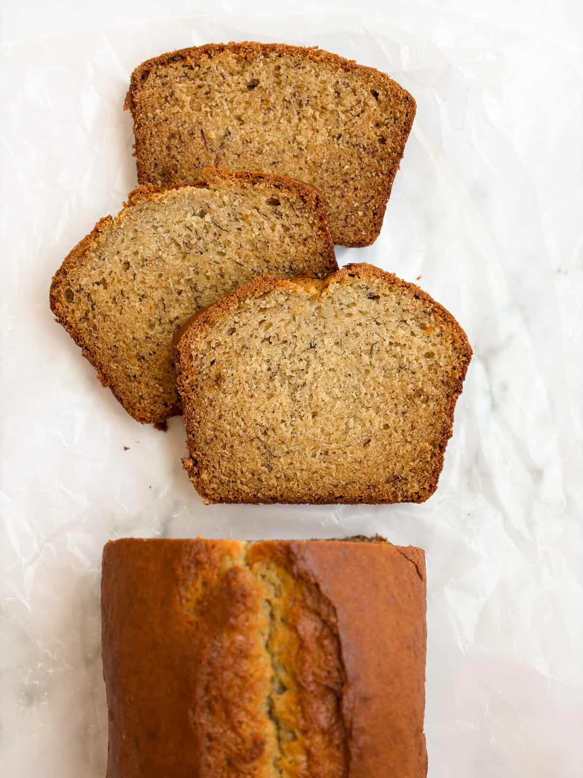 sour cream banana bread cut into slices.